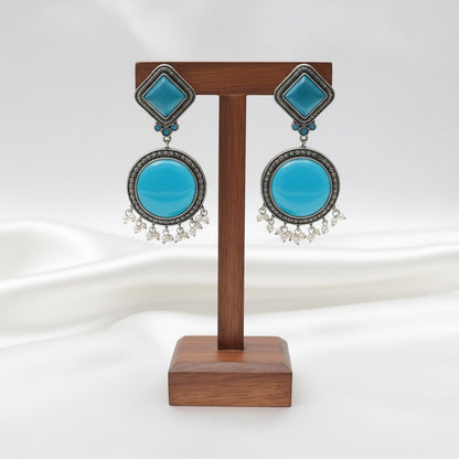 Exquisite Silver Oxidized Dangler Earrings in Tropical Teal Monalisa Stone