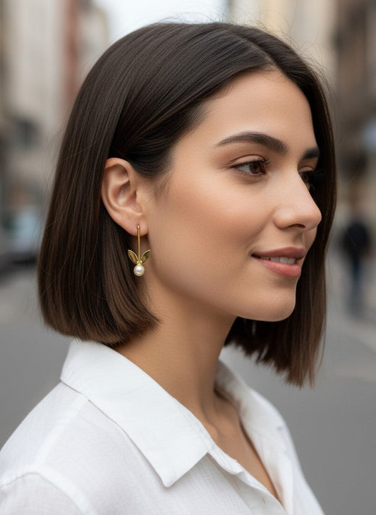 Model wearing Gold-Plated Pearl Leaf Drop Earrings for Women - Work Wear