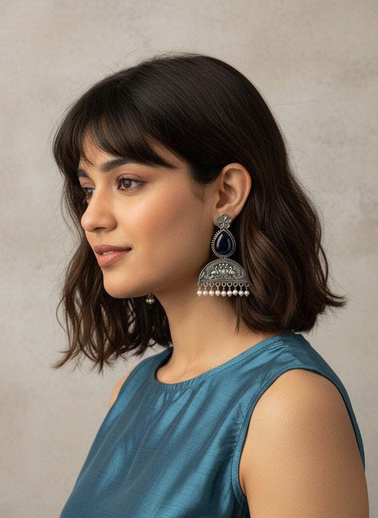 Model wearing Mayura Floral Motifs Dark Blue Monalisa Stone Dangler Earrings with Pearl detailing for Women - All Occasions 