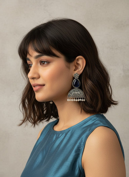 Model wearing Mayura Floral Motifs Dark Blue Monalisa Stone Dangler Earrings with Pearl detailing for Women - All Occasions 