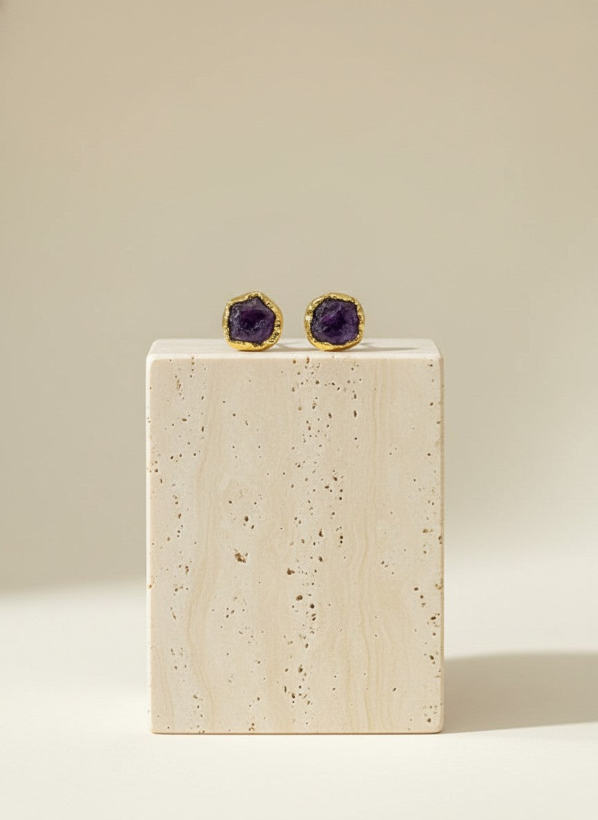 Raw amethyst stud earrings set in gold. Minimalist natural gemstone jewelry with organic texture—perfect for everyday elegance and timeless styling.