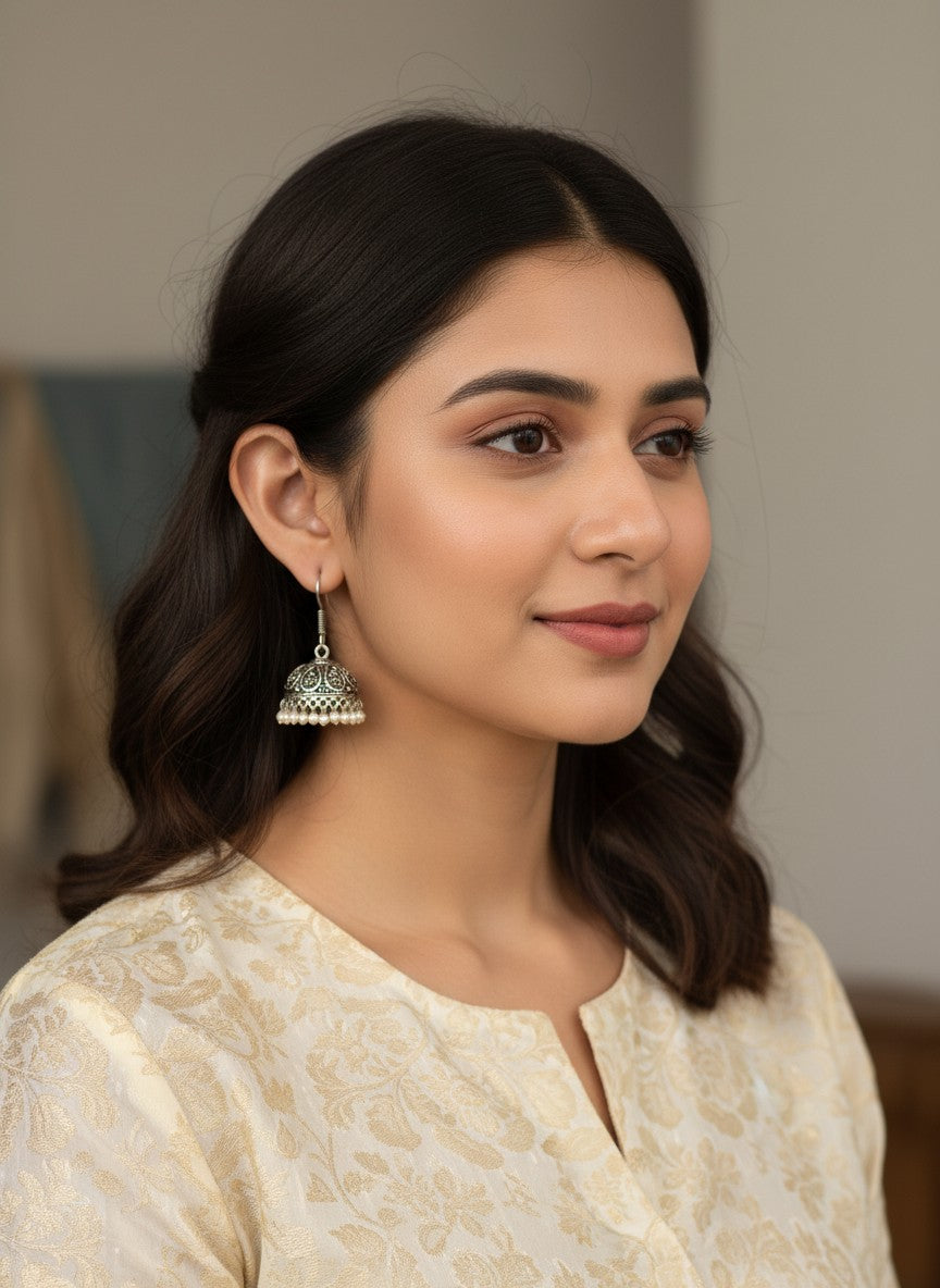 Model wearing Silver Oxidized Classic Jhumka Earrings with Intricate Filigree Detailing for Women - Everyday Wear