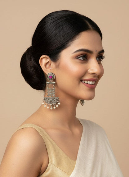 Model wearing Silver Oxidized Dangler Earrings with Pearls and Pink Monalisa Stones for Women - Occasion Wear