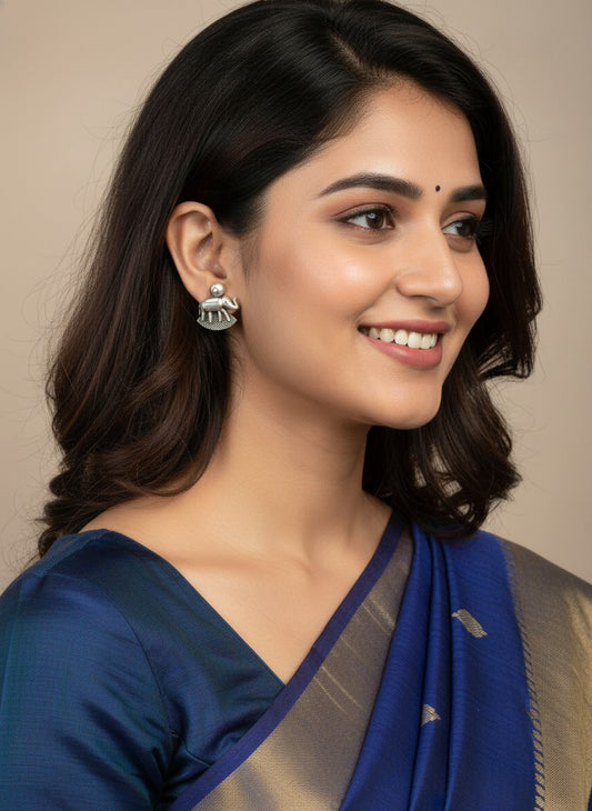 Model wearing Silver Oxidized Elephant Motif Stud Earrings for Women - Daily Wear