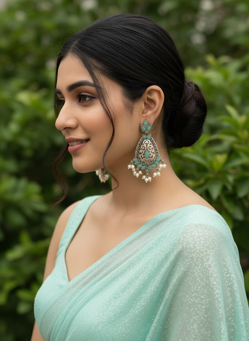 Model wearing Silver Oxidized Filigree Teardrop Earrings with Mint Stones & Pearl Drops for Women - Festive Wear