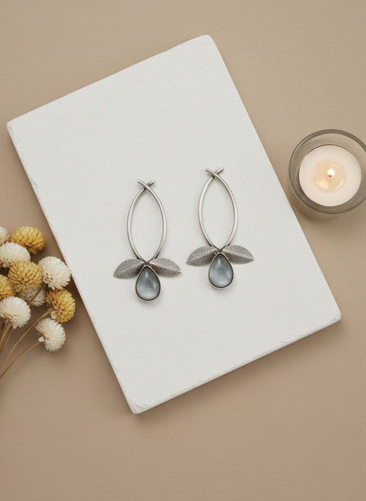 Styled prop of Silver Oxidized Leaf Design Earrings with Grey Stone Drop for Women - All Occasions Wear