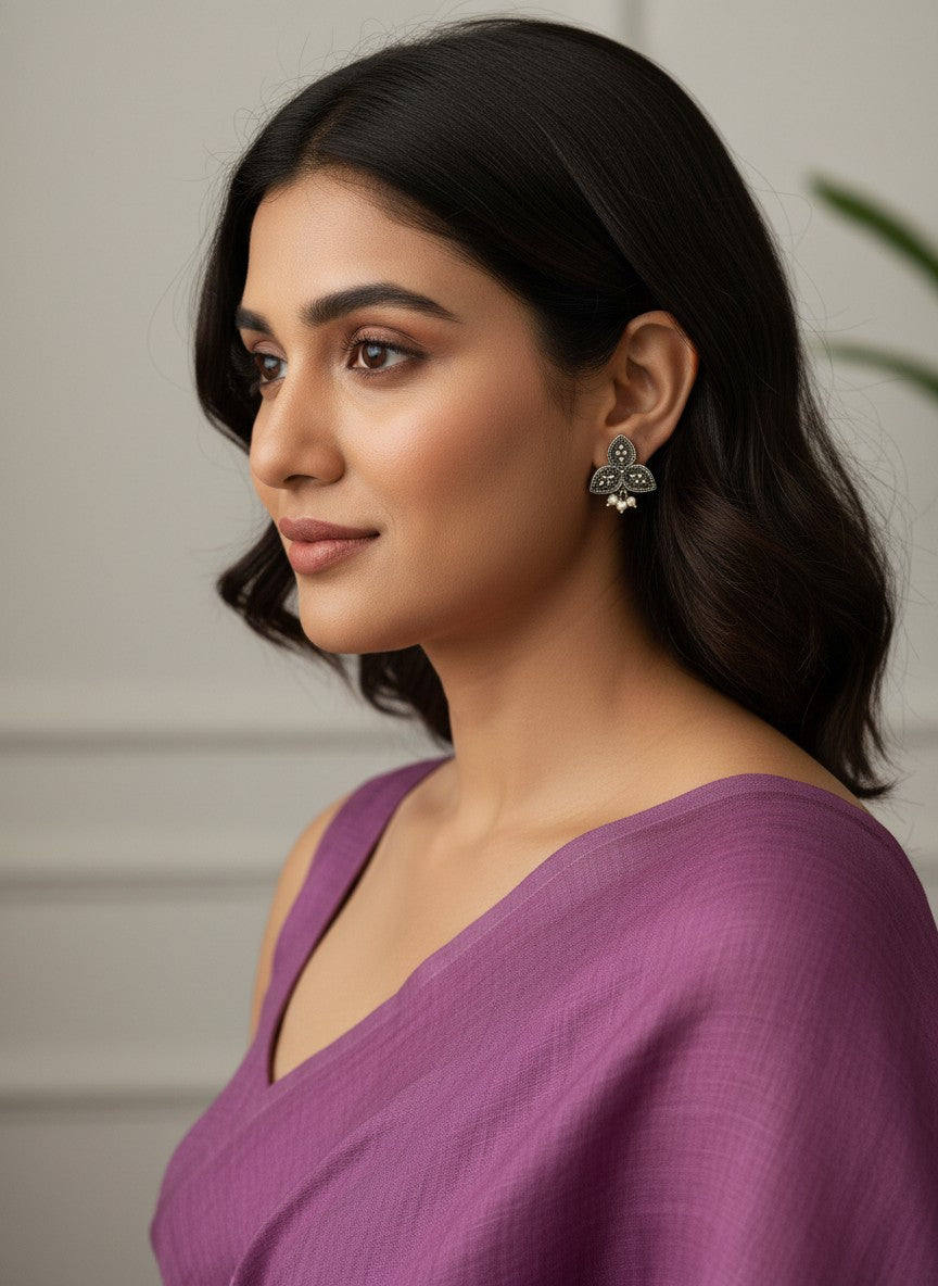 Model wearing Silver Oxidized Triple Leaf Stud Earrings with Pearl Drops for Women - Everyday Wear 
